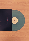 no moving air vinyl half way exposed out of its case on wooden background