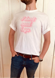 guy wearing " I don't need boys" white t-shirt