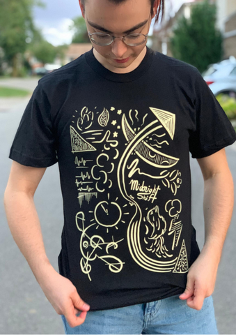 girl wearing black and yellow midnight shift  t-shirt
