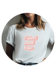 girl wearing "I don't need boys" white t-shirt