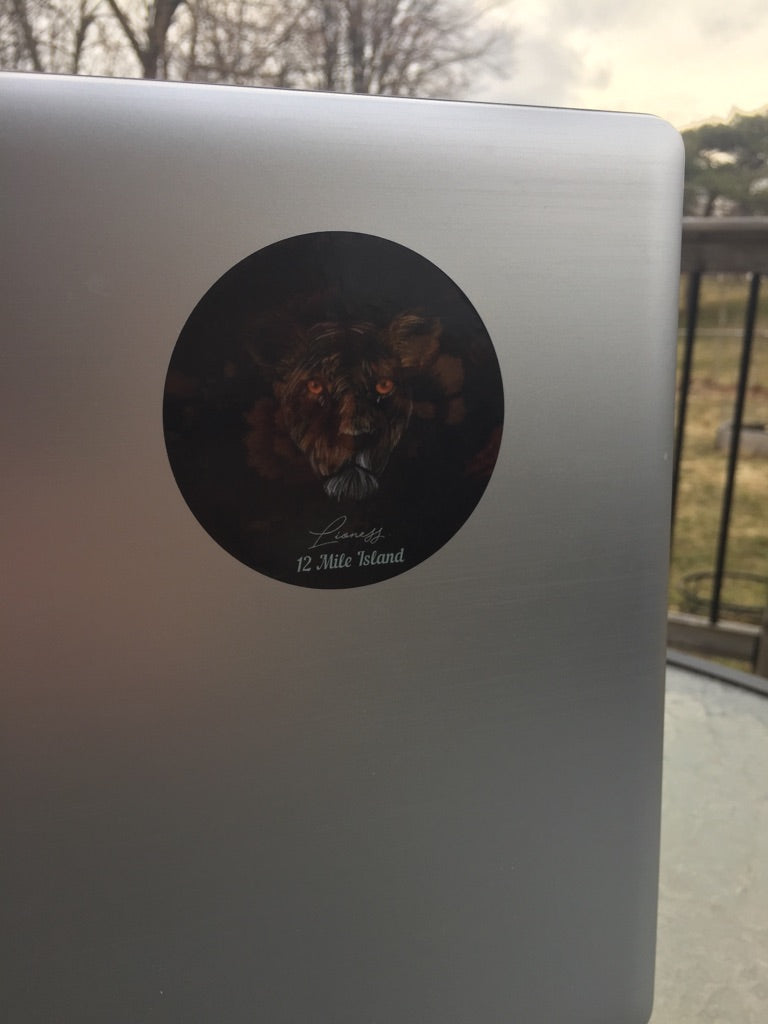 'Lioness 12 Mile Island' sticker on a laptop