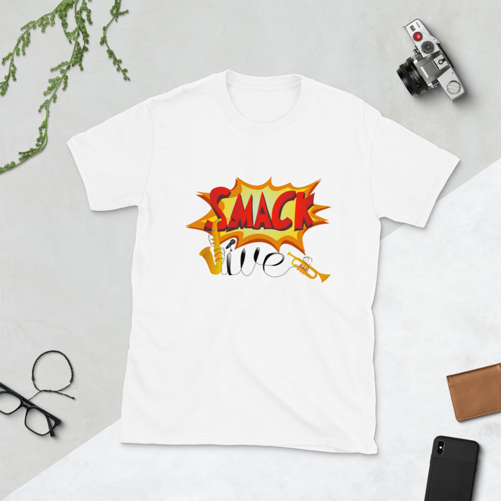 Smackjive | Comic Sax White T-Shirt layed flat on a white background surrounded by a camera, phone, wallet, glasses, bracelet